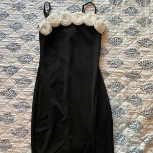 Chic Black Dress with White Rosette Details